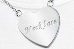 writing on a silver heart pendant